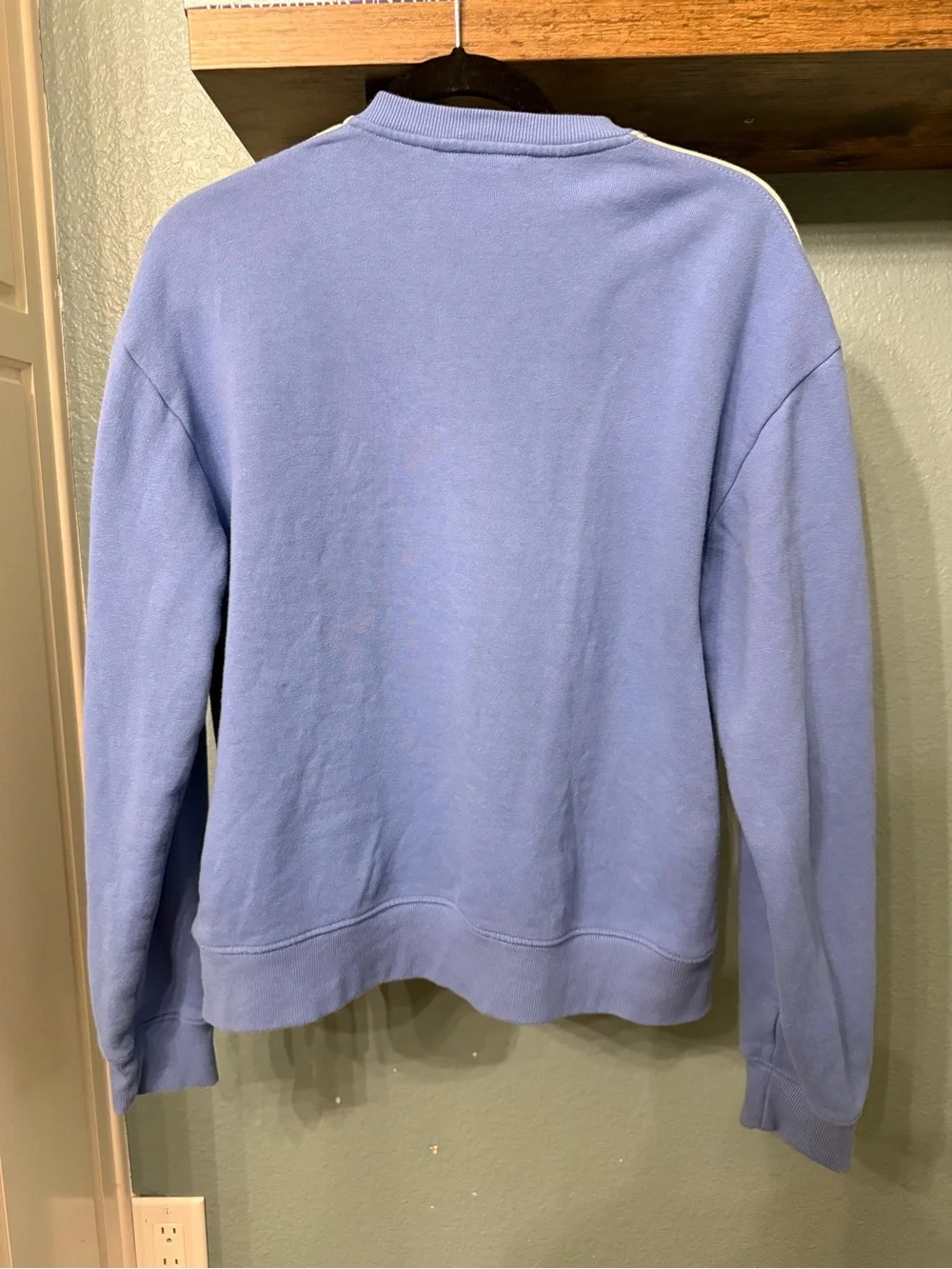 cotopaxi blue crewneck sweater with multicolor stripe logo